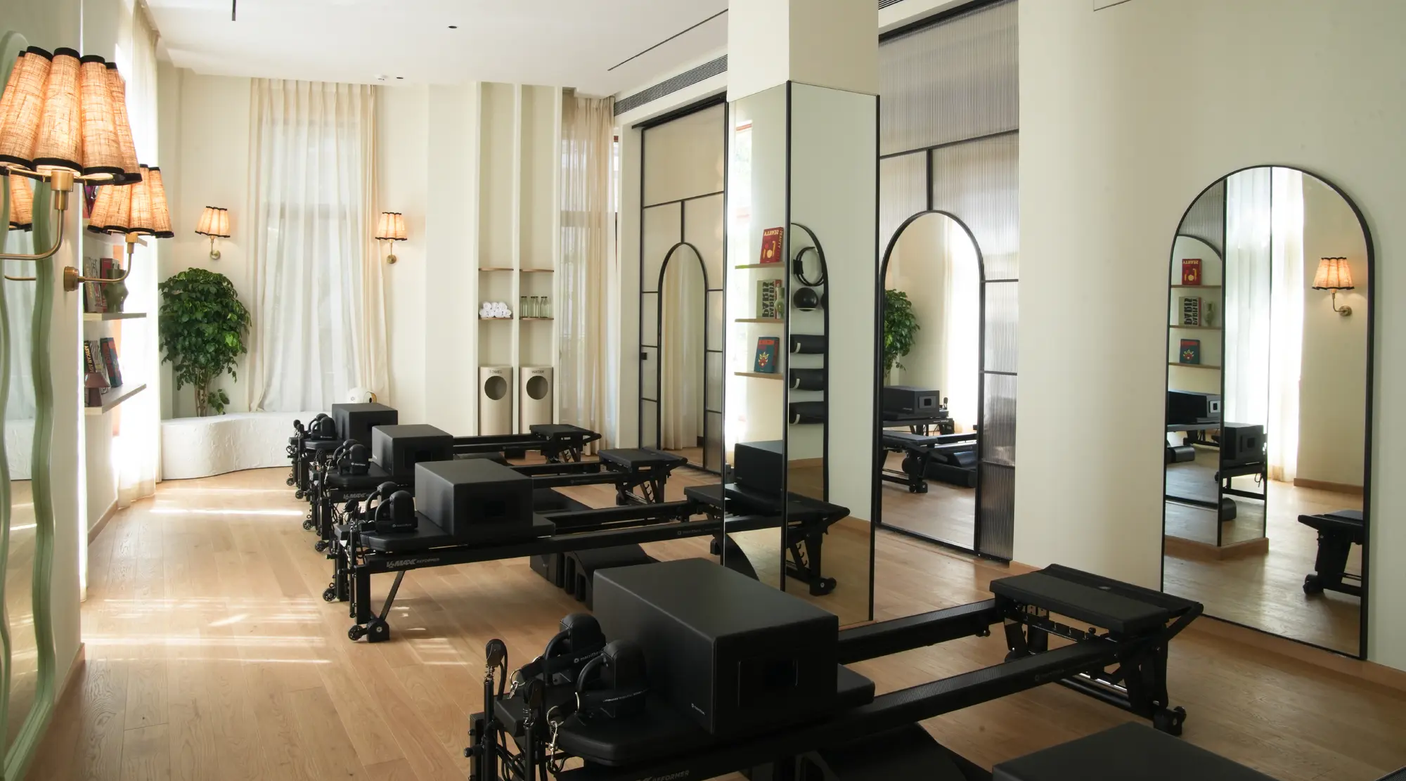 The mirrored Pilates studio at Unlock Everyday with reformer machines